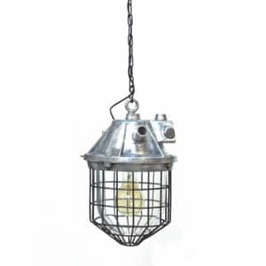 anciellitude Chemical industry light with thick glass cover by fence.