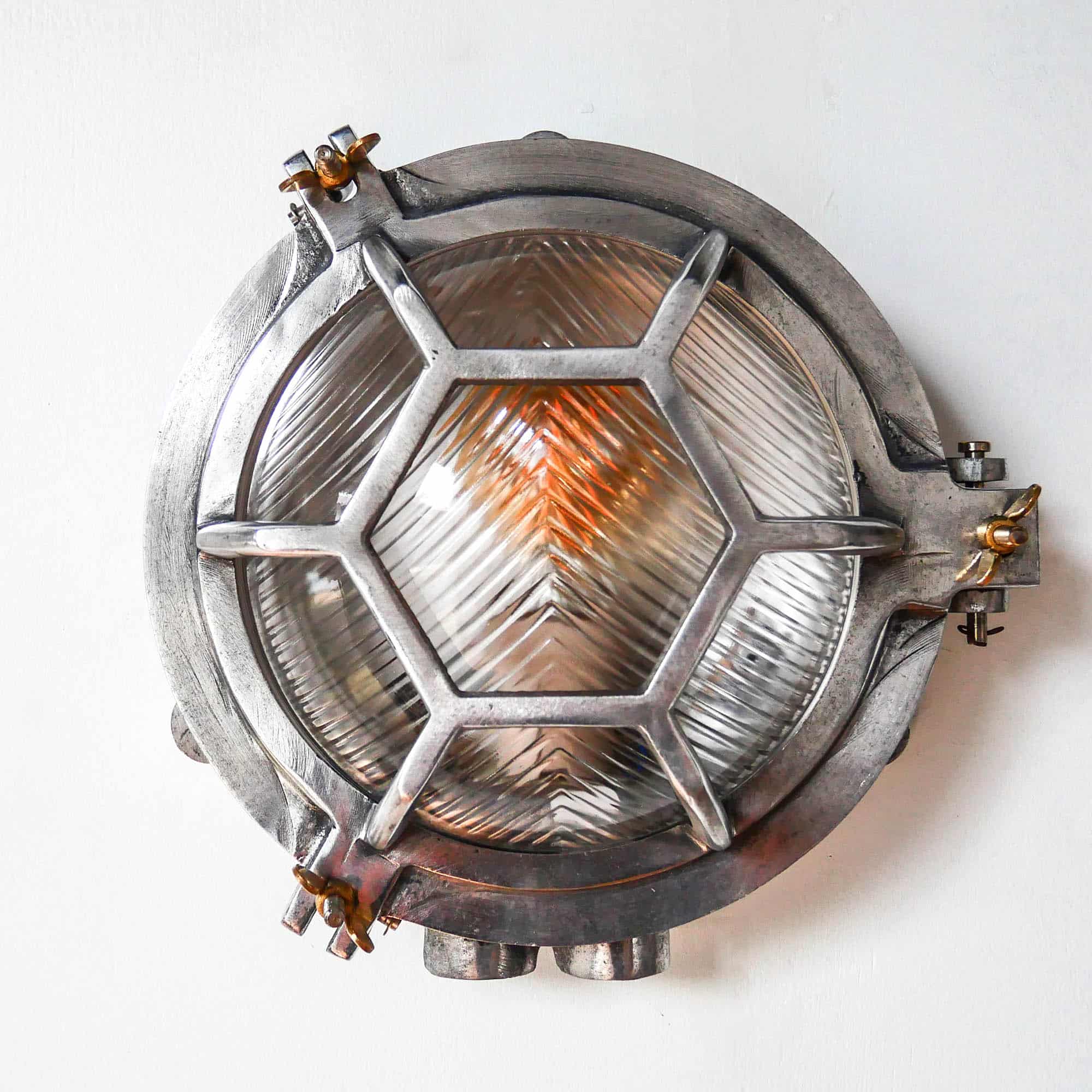 Old Cast Aluminum Wall Light with Hexagonal Grid and Wide Streaked Glass. anciellitude